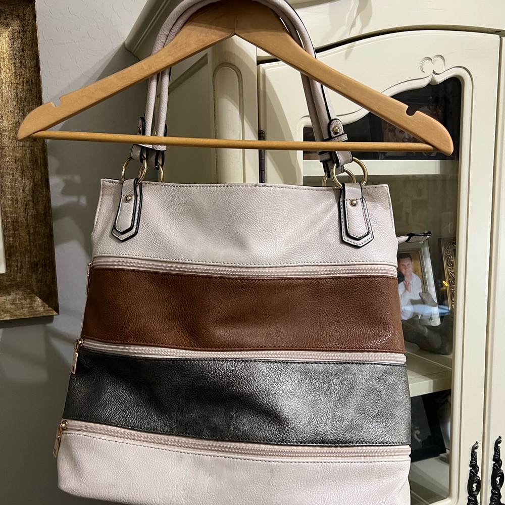 Cream hobo bag with brown and pewter accents